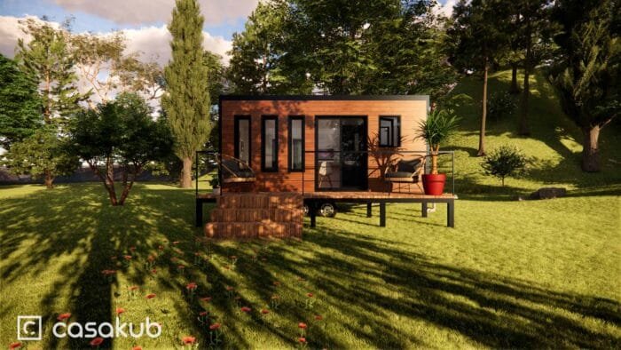 Tiny house moderne avec terrasse en ossature bois, parfait pour les auto-constructeurs.